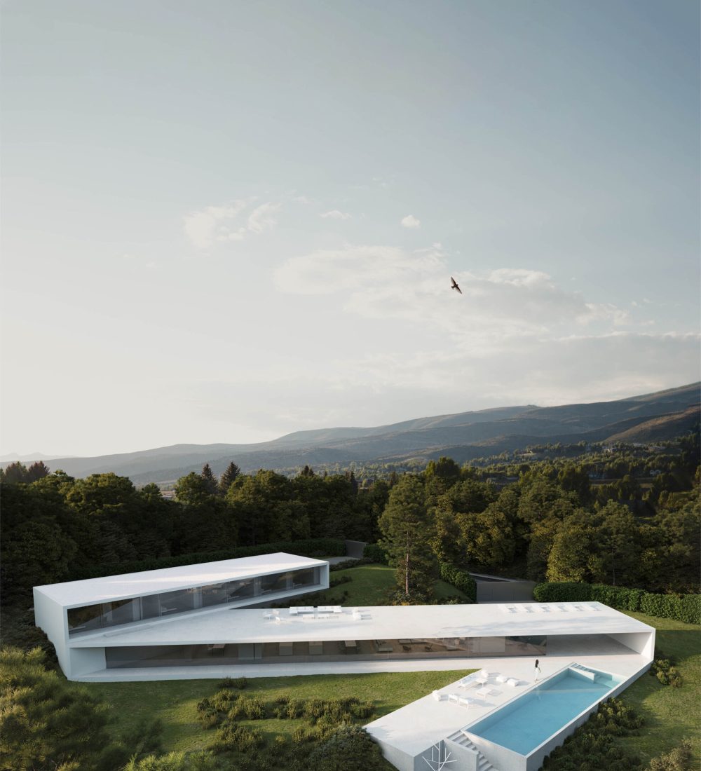 Aerial view of Villa 95, a modern white luxury villa with a pool in a green Sotogrande landscape.