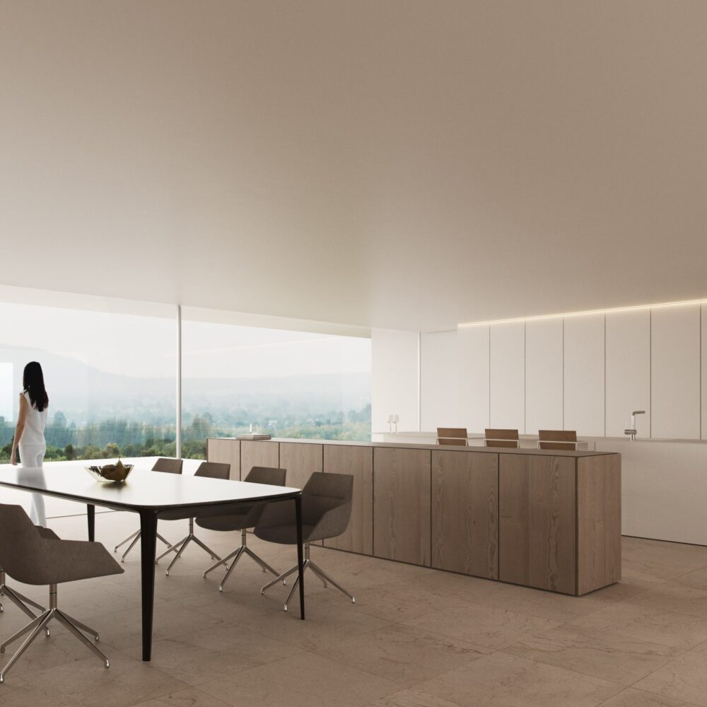 Amplia cocina comedor de lujo con vistas panorámicas y mujer de espaldas en Villa 46.