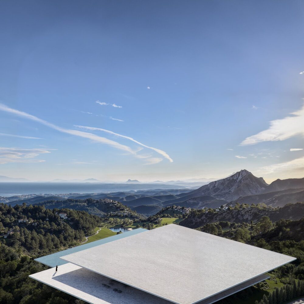 Moderna villa con piscina infinita voladiza y vistas a la Costa del Sol.
