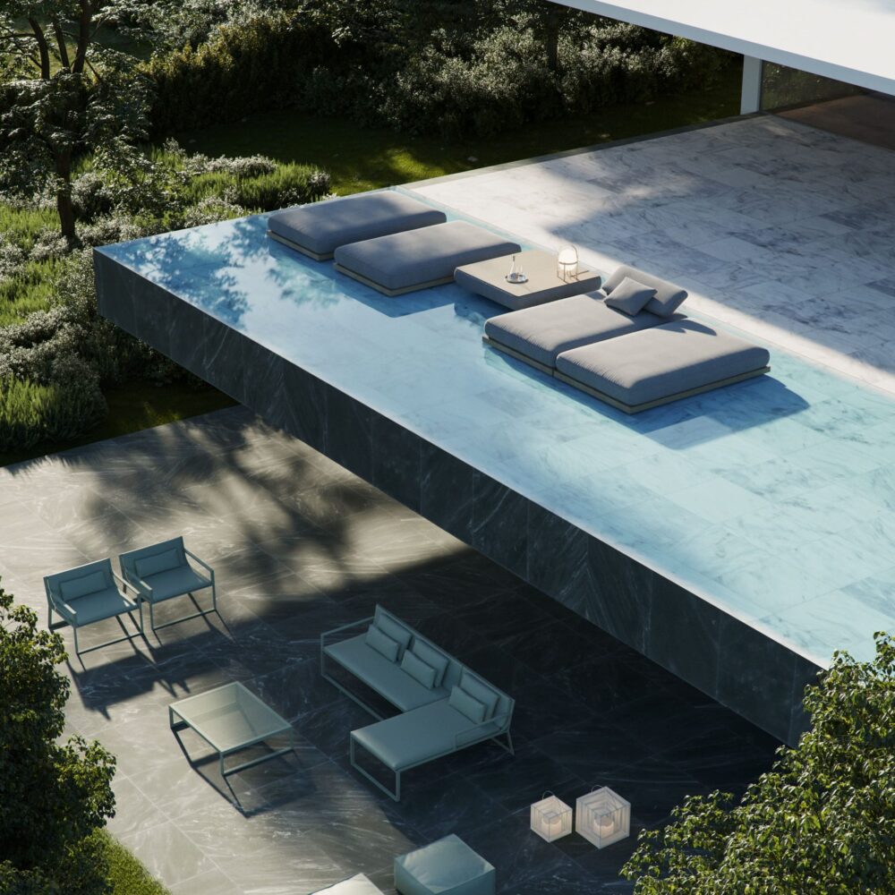 Moderna villa de lujo con piscina infinita, terraza de mármol y zona de estar exterior ajardinada.