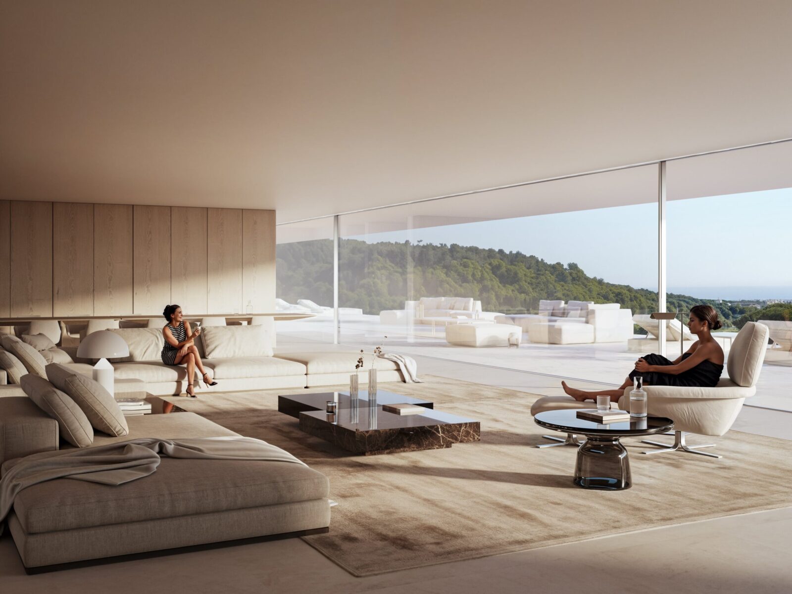 Cork Oak Mansion's luxurious living room with two women, large windows, and a panoramic view of green hills and the sea.