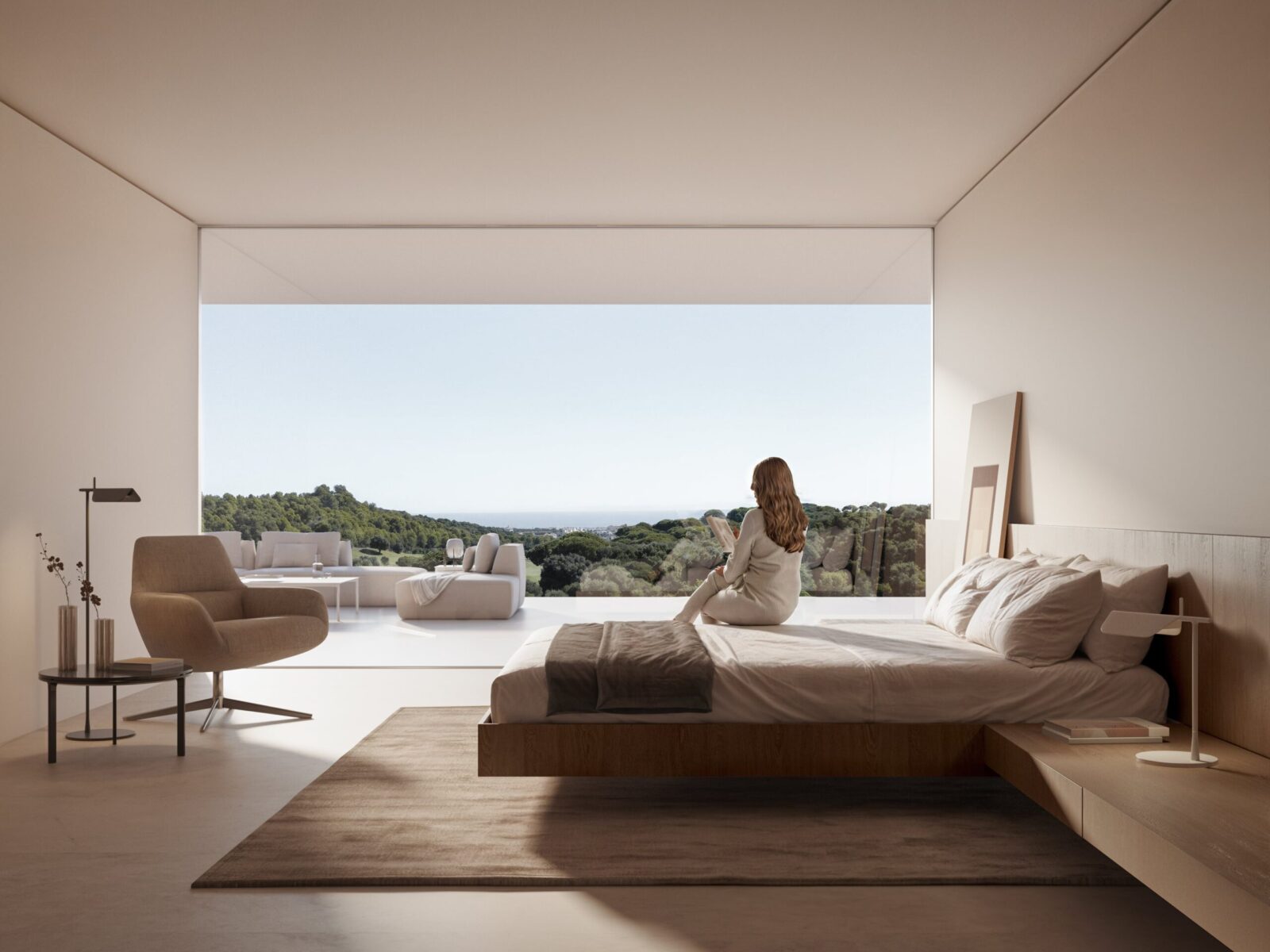 Minimalist luxury villa bedroom with a woman on the bed admiring a panoramic view of green hills and the sea.