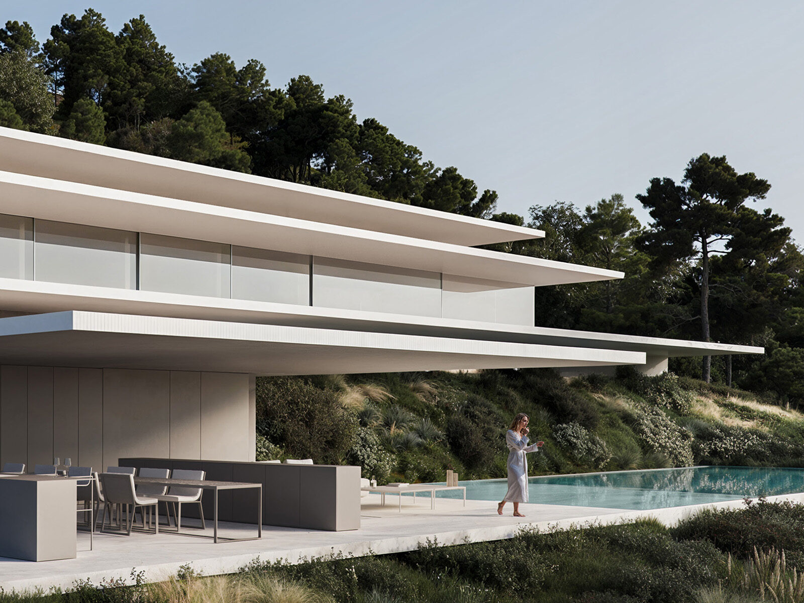Contemporary multi-level villa with an outdoor kitchen, infinity pool, and lush landscape, epitomizing Sotogrande living.