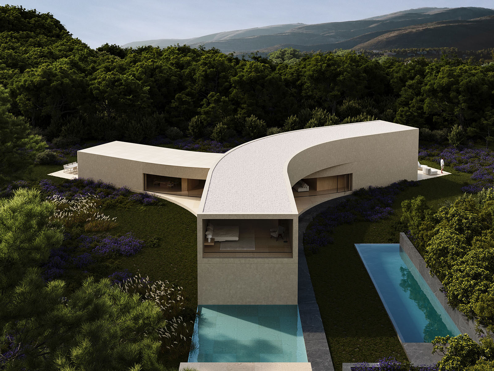 Aerial view of a modern Y-shaped mansion with pools in a green Sotogrande landscape.