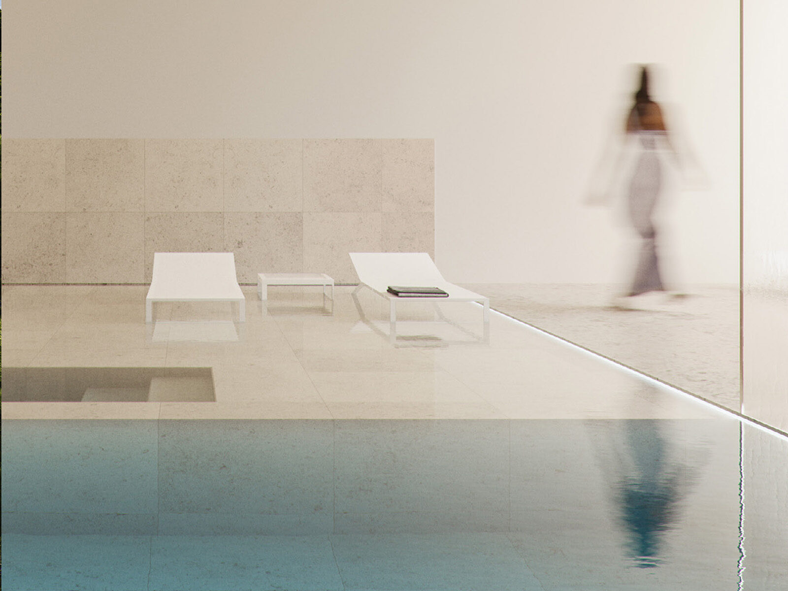 Modern poolside area with lounge chairs and a blurred person, reflecting luxury living in Sotogrande.