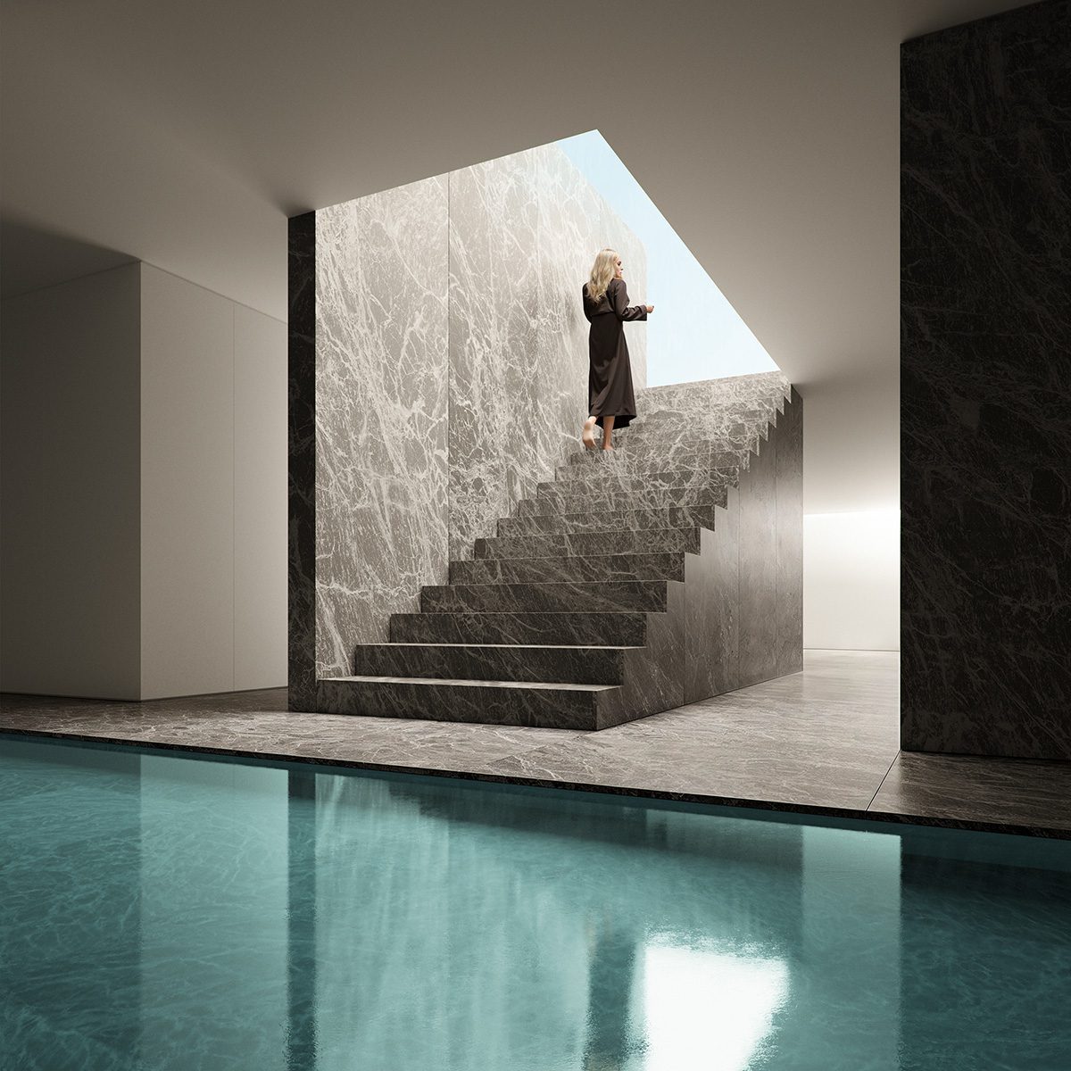 Mujer descalza subiendo escaleras de mármol veteado en una villa de Fran Silvestre con piscina.