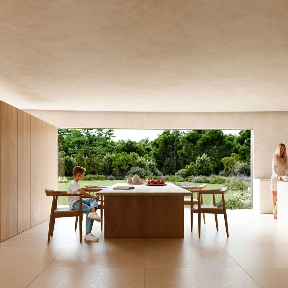 Interior luminoso de una villa de lujo en Sotogrande con una familia, mesa de comedor y vistas a un jardín frondoso.