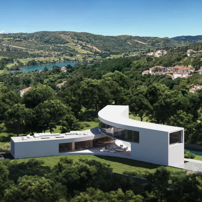 Aerial view of modern Villa Stern, a luxury villa, with curved and linear sections, a pool, and golf course views.