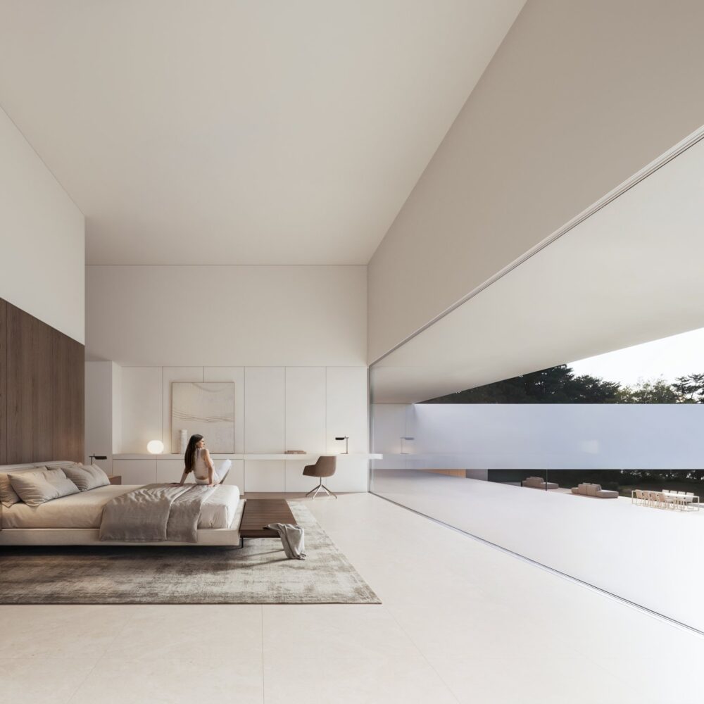 Modern luxury bedroom at Cork Oak Mansion with a large bed, a woman, and a vast opening to an outdoor patio.