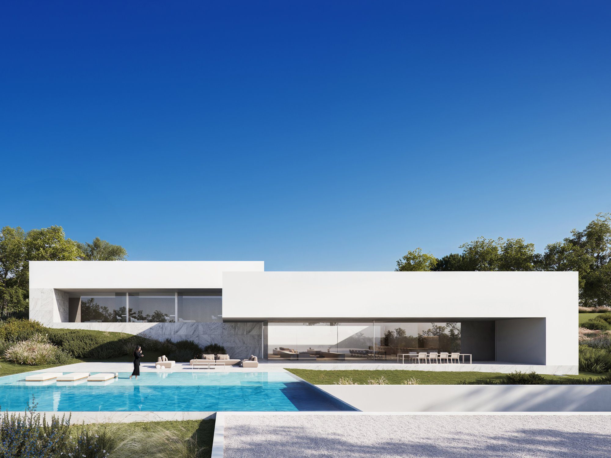 Villa Noon: a modern white luxury villa with an infinity pool, a person, and outdoor lounge areas.